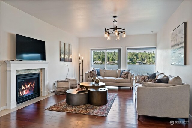1558 Fairview St, Bellingham, WA 98229 - living area with hardwood / wood-style flooring, a chandelier, and a glass covered fireplace