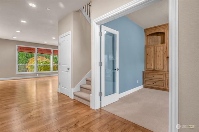 hall with light hardwood / wood-style flooring