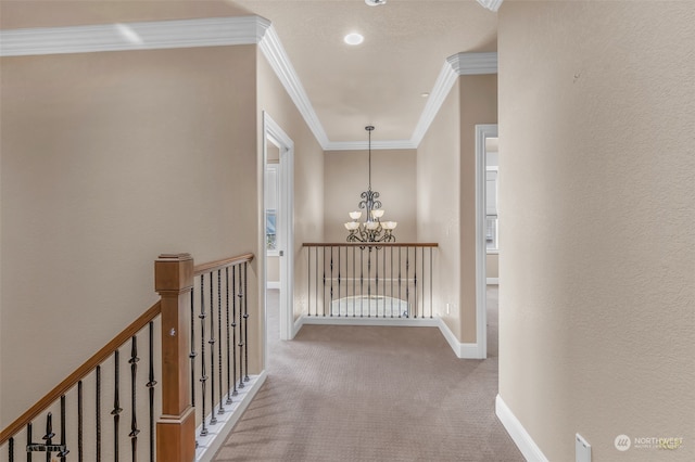 corridor with light carpet, an inviting chandelier, and crown molding