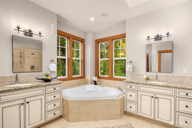 bathroom featuring tile patterned floors, vanity, and independent shower and bath