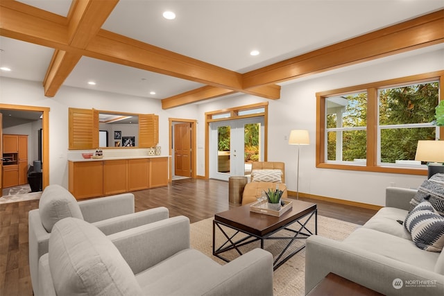 living room with beamed ceiling, plenty of natural light, dark wood-type flooring, and french doors