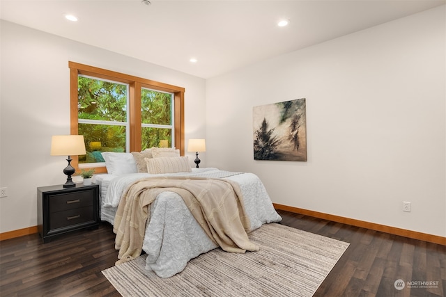 bedroom featuring dark hardwood / wood-style flooring