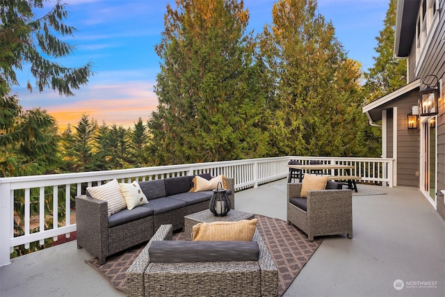 patio terrace at dusk featuring outdoor lounge area