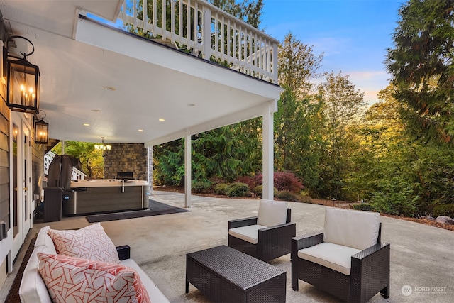 patio terrace at dusk with an outdoor kitchen and an outdoor living space