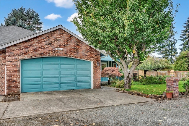 garage featuring a yard