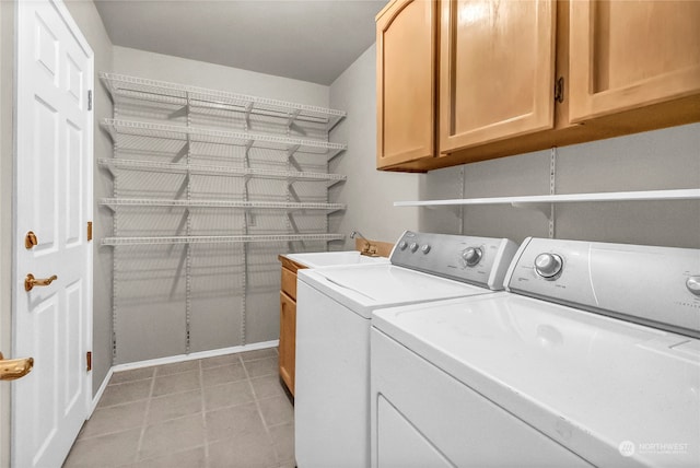 laundry room with sink, separate washer and dryer, and cabinets