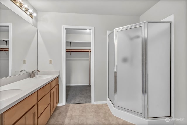 bathroom featuring vanity, walk in shower, and hardwood / wood-style flooring