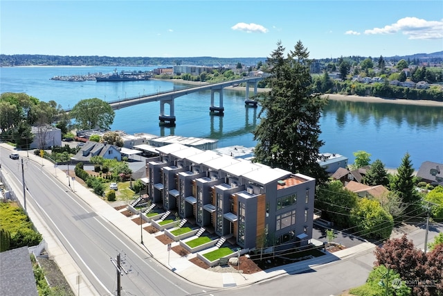 birds eye view of property with a water view