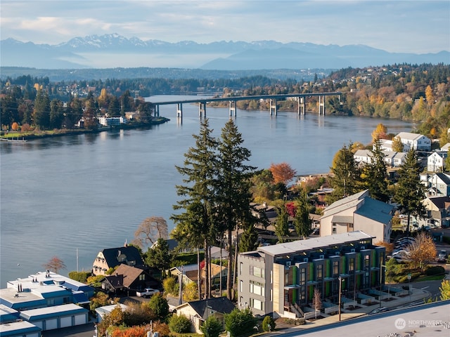 birds eye view of property featuring a water and mountain view