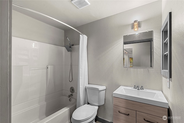 full bathroom featuring vanity, toilet, and shower / tub combo with curtain