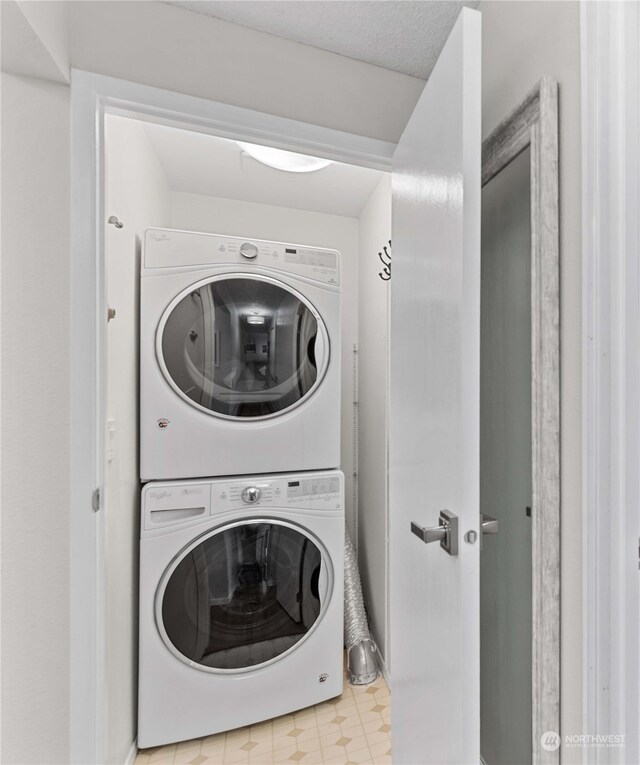 laundry room with stacked washer and dryer