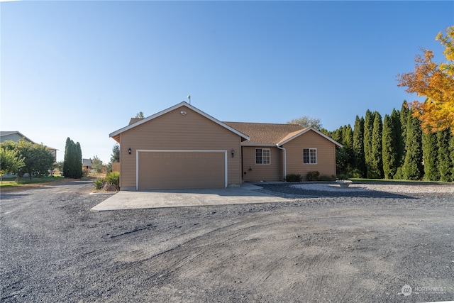 single story home featuring a garage