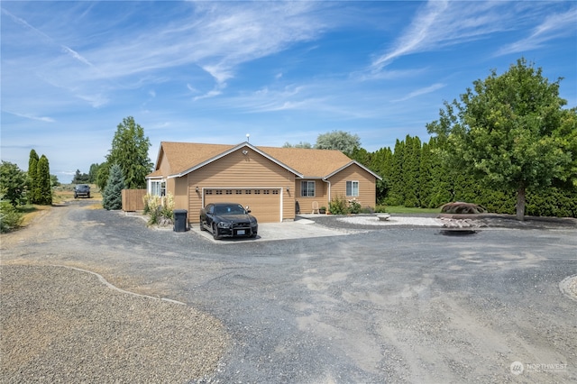 ranch-style home featuring a garage