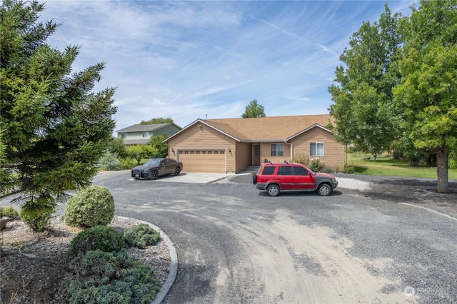 ranch-style home featuring a garage