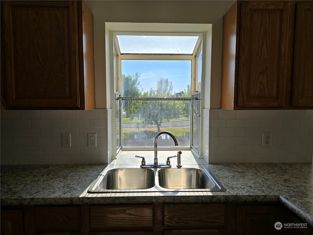 kitchen featuring sink and backsplash