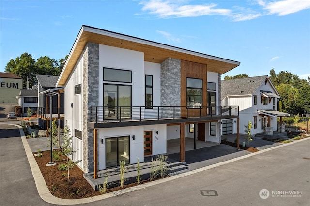 contemporary home featuring a balcony