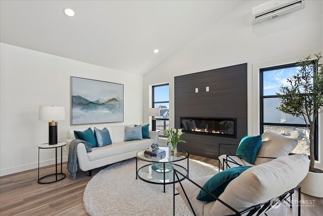 living room featuring hardwood / wood-style floors, high vaulted ceiling, and a wall mounted AC