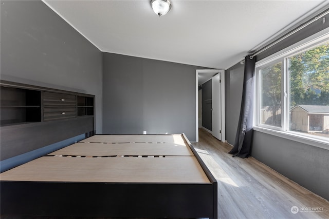 unfurnished sunroom with lofted ceiling