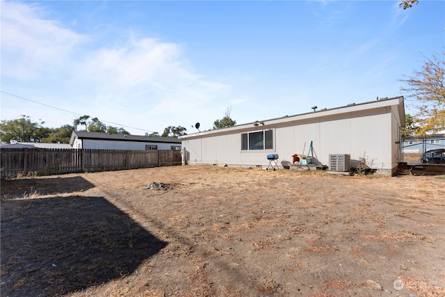 rear view of house with central AC