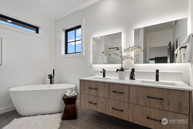 bathroom featuring vanity, tile patterned flooring, and a bathing tub