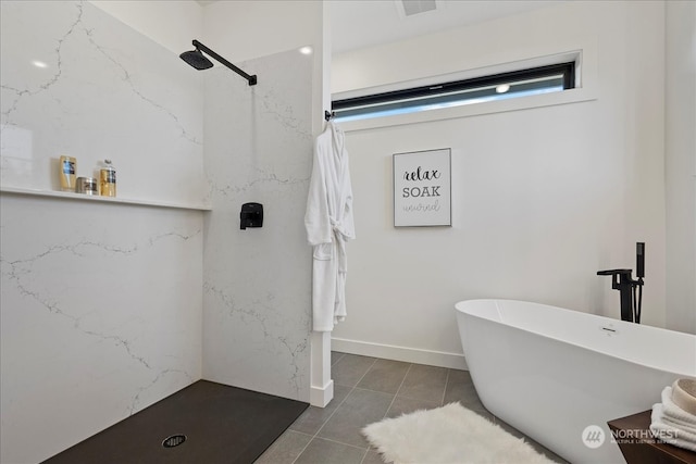 bathroom with independent shower and bath and tile patterned flooring