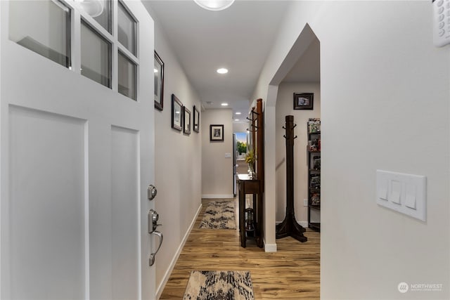 hallway featuring wood-type flooring
