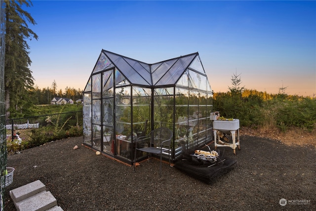 view of outdoor structure at dusk