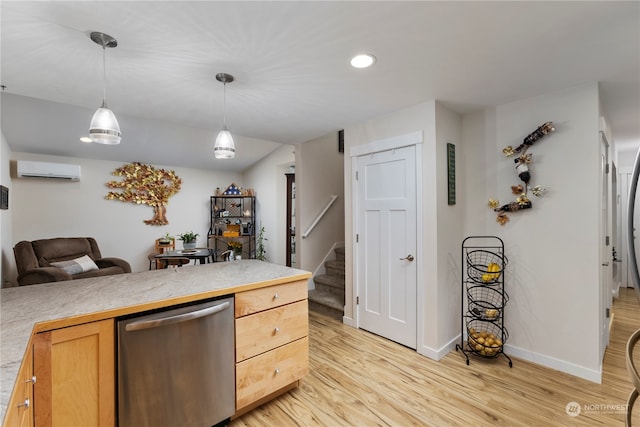 kitchen featuring hanging light fixtures, stainless steel dishwasher, light brown cabinetry, a wall mounted air conditioner, and light hardwood / wood-style flooring