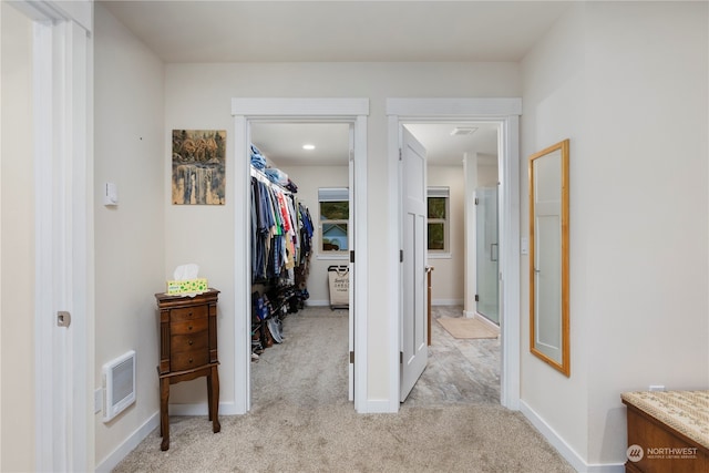 corridor featuring light carpet