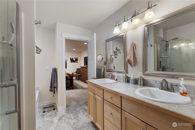 bathroom with vanity and separate shower and tub