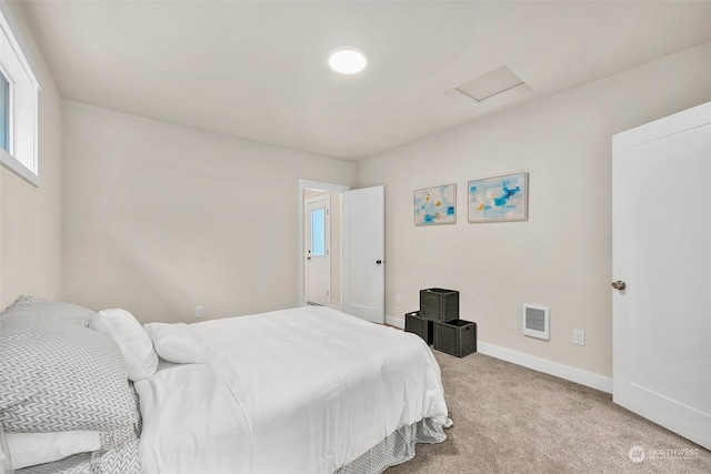 bedroom with light carpet