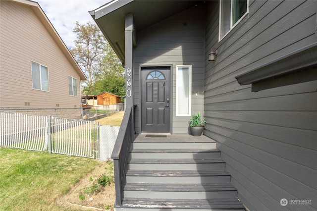 260 Chestnut St, Chelan Falls, WA 98817 - view of exterior entry with a lawn and fence