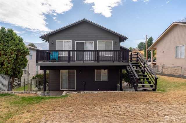 260 Chestnut St, Chelan Falls, WA 98817 - back of house with a fenced backyard, a yard, stairs, and a deck
