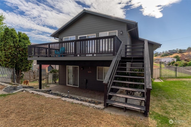 260 Chestnut St, Chelan Falls, WA 98817 - rear view of property featuring a fenced backyard, a wooden deck, stairway, a yard, and a patio