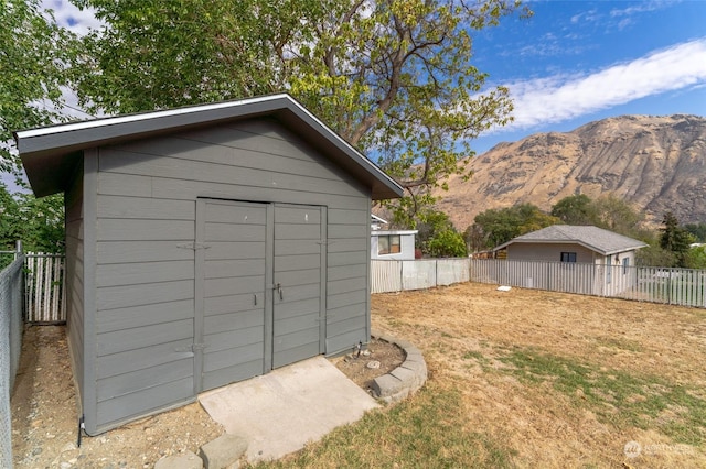 260 Chestnut St, Chelan Falls, WA 98817 - view of shed with a fenced backyard and a mountain view