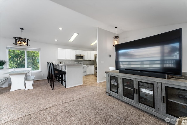 260 Chestnut St, Chelan Falls, WA 98817 - living area featuring a chandelier, baseboards, light colored carpet, lofted ceiling, and recessed lighting