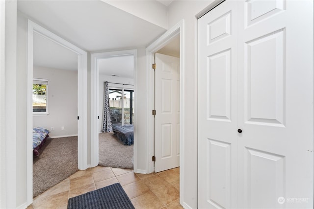 260 Chestnut St, Chelan Falls, WA 98817 - hallway featuring light colored carpet, baseboards, and light tile patterned flooring