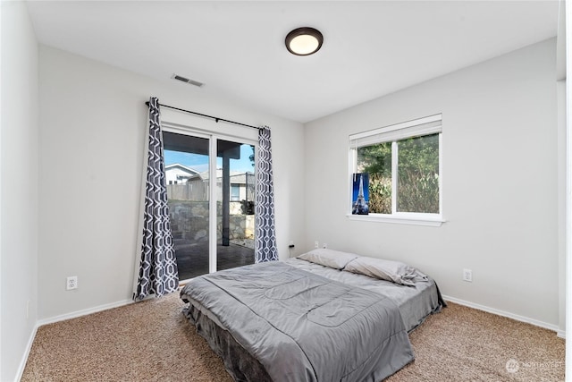 260 Chestnut St, Chelan Falls, WA 98817 - bedroom with light carpet, baseboards, visible vents, and access to exterior
