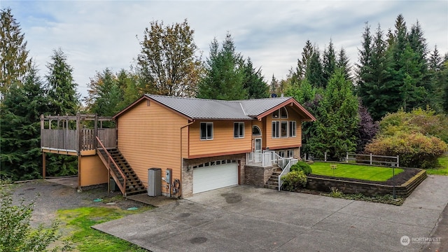 view of front of home with a front lawn and a garage