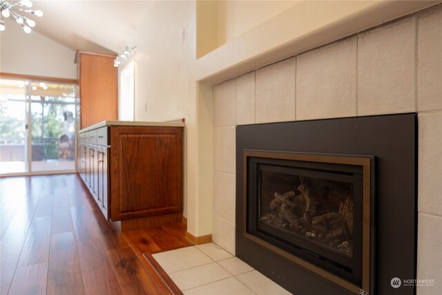 interior details featuring hardwood / wood-style floors and a notable chandelier