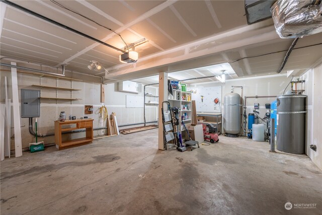 garage featuring a garage door opener and electric panel