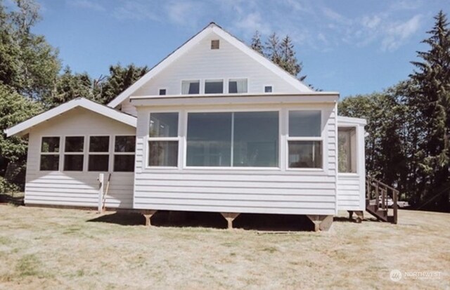 back of property featuring a sunroom