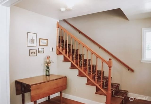 stairway featuring hardwood / wood-style flooring