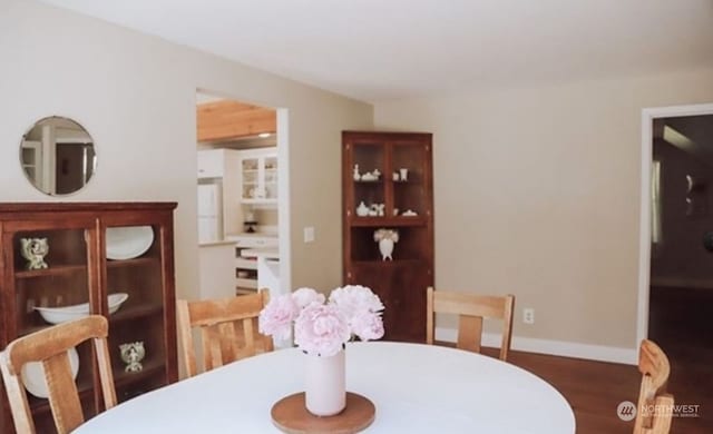 dining area with dark wood-type flooring