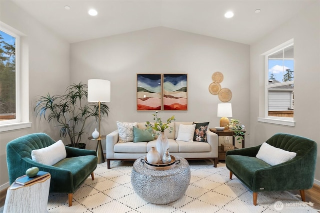 living area featuring vaulted ceiling, wood finished floors, and recessed lighting