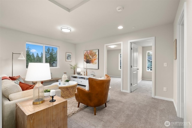 sitting room with recessed lighting, baseboards, and light colored carpet