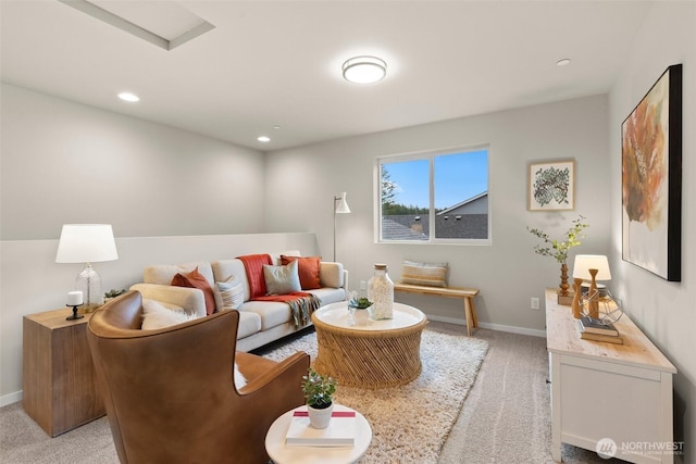 living room with recessed lighting, light carpet, and baseboards