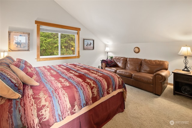 carpeted bedroom with vaulted ceiling