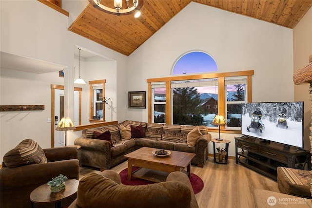 living room featuring high vaulted ceiling, wood finished floors, and wood ceiling