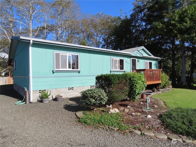 view of front of property with a wooden deck